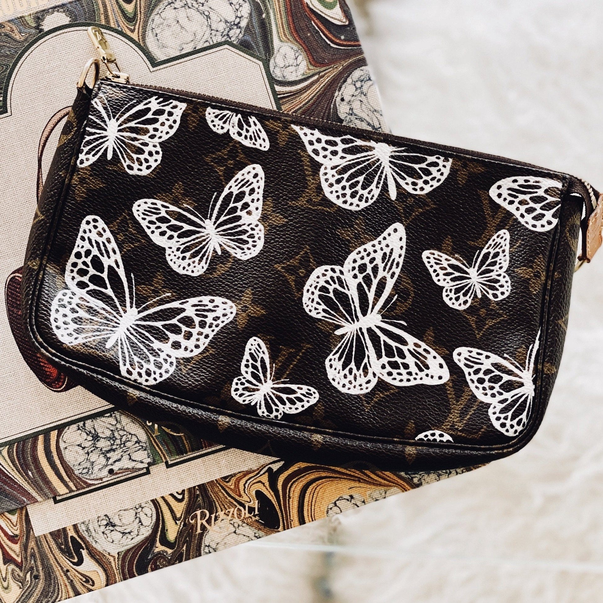 Premium AI Image  a butterfly and flowers by louis vuitton